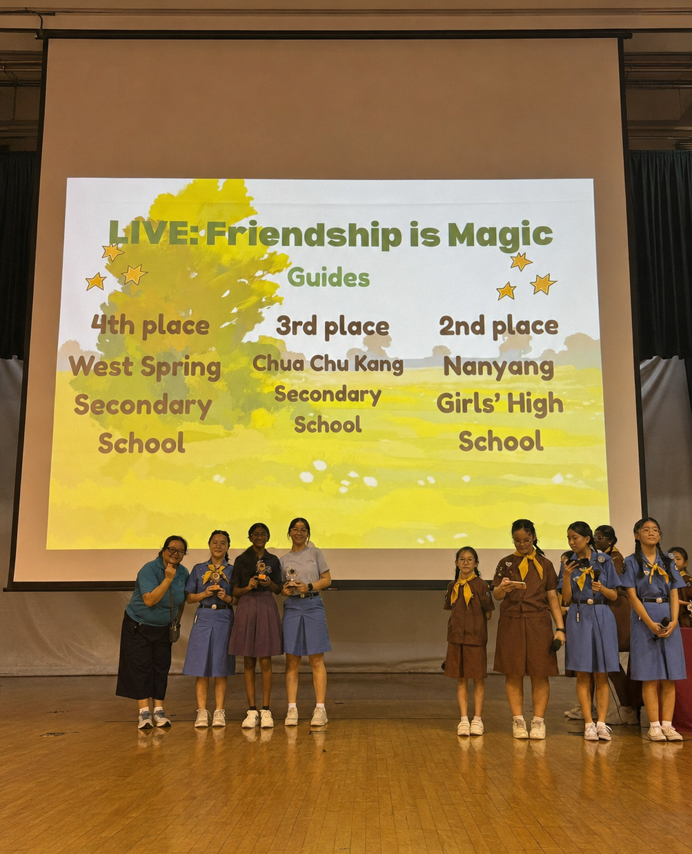 eight girl guides on stage
